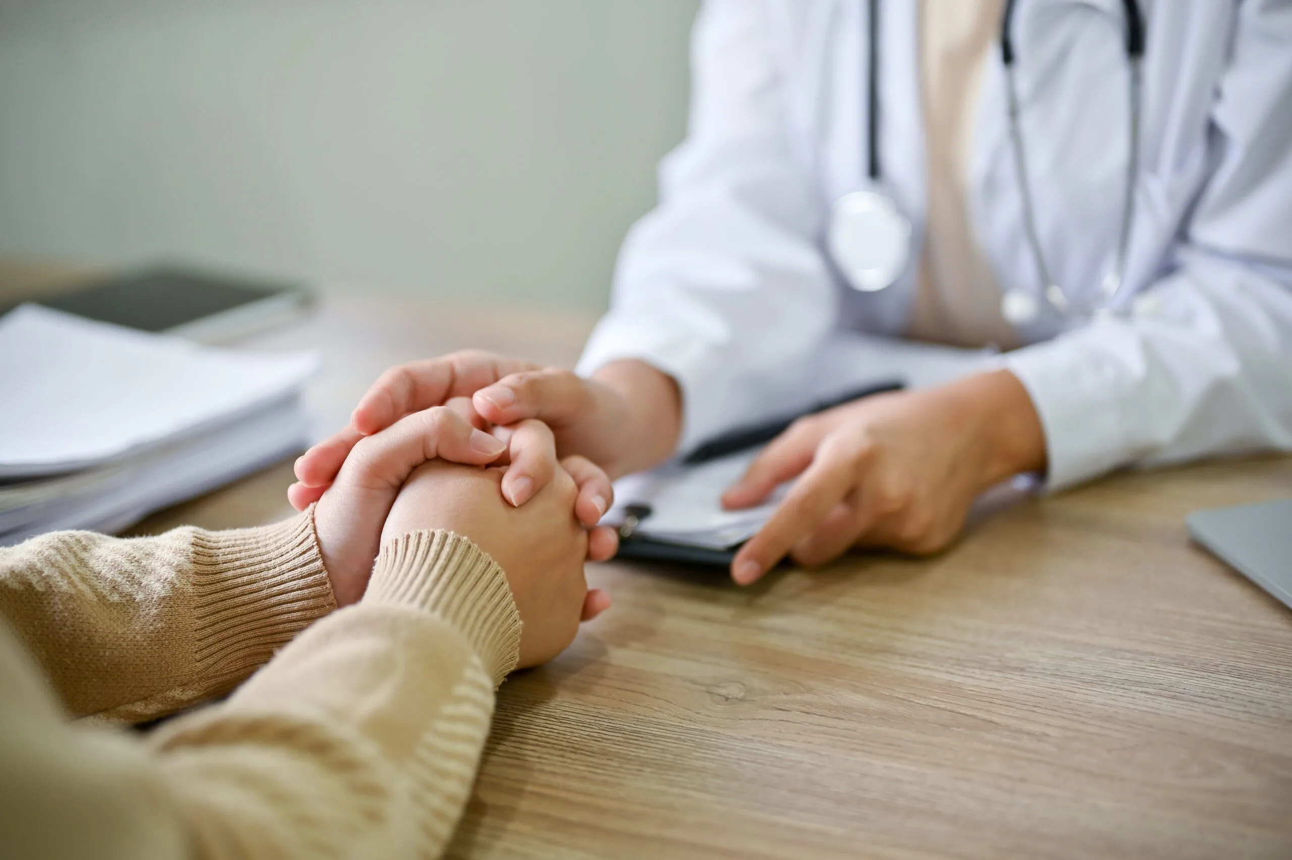 Close Up View Of Doctor Touching Patient Hand, Showing Empty And Kindness